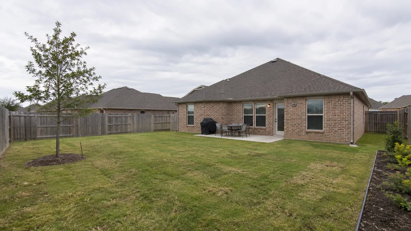 A newer fenced backyard.